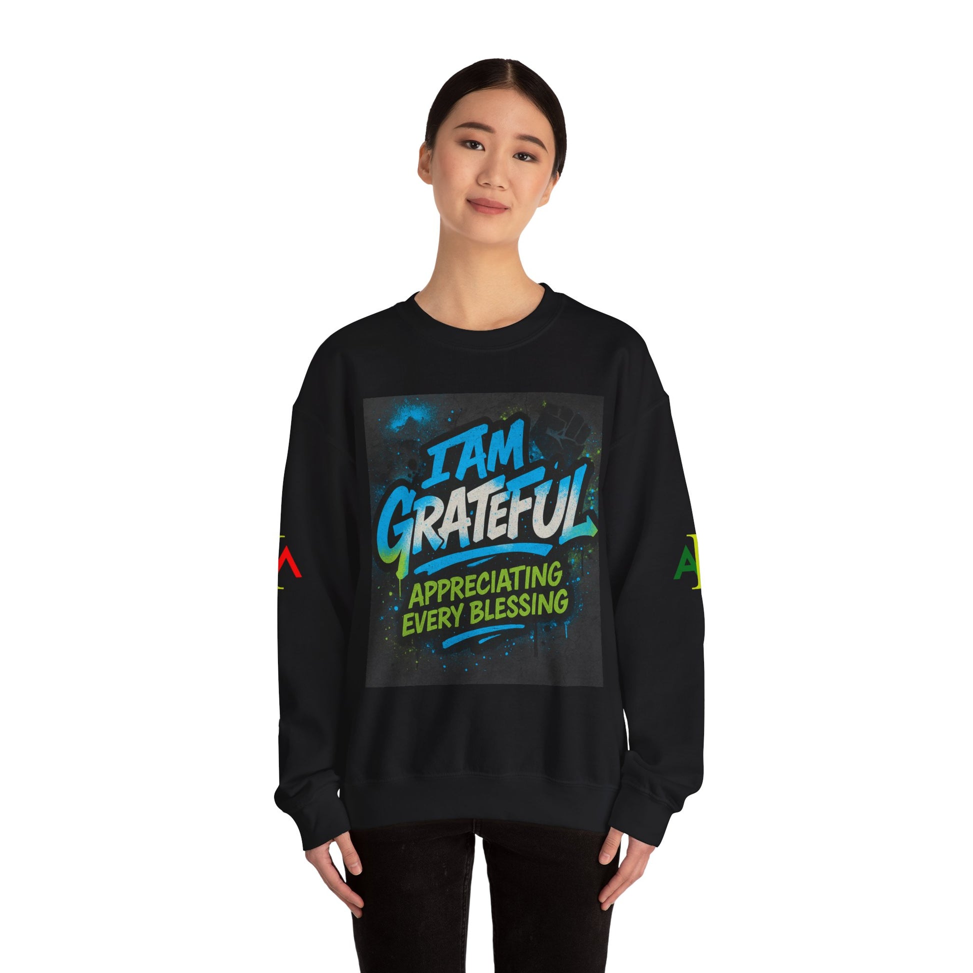 Person wearing a black sweatshirt with 'I AM GRATEFUL' text design on a white background