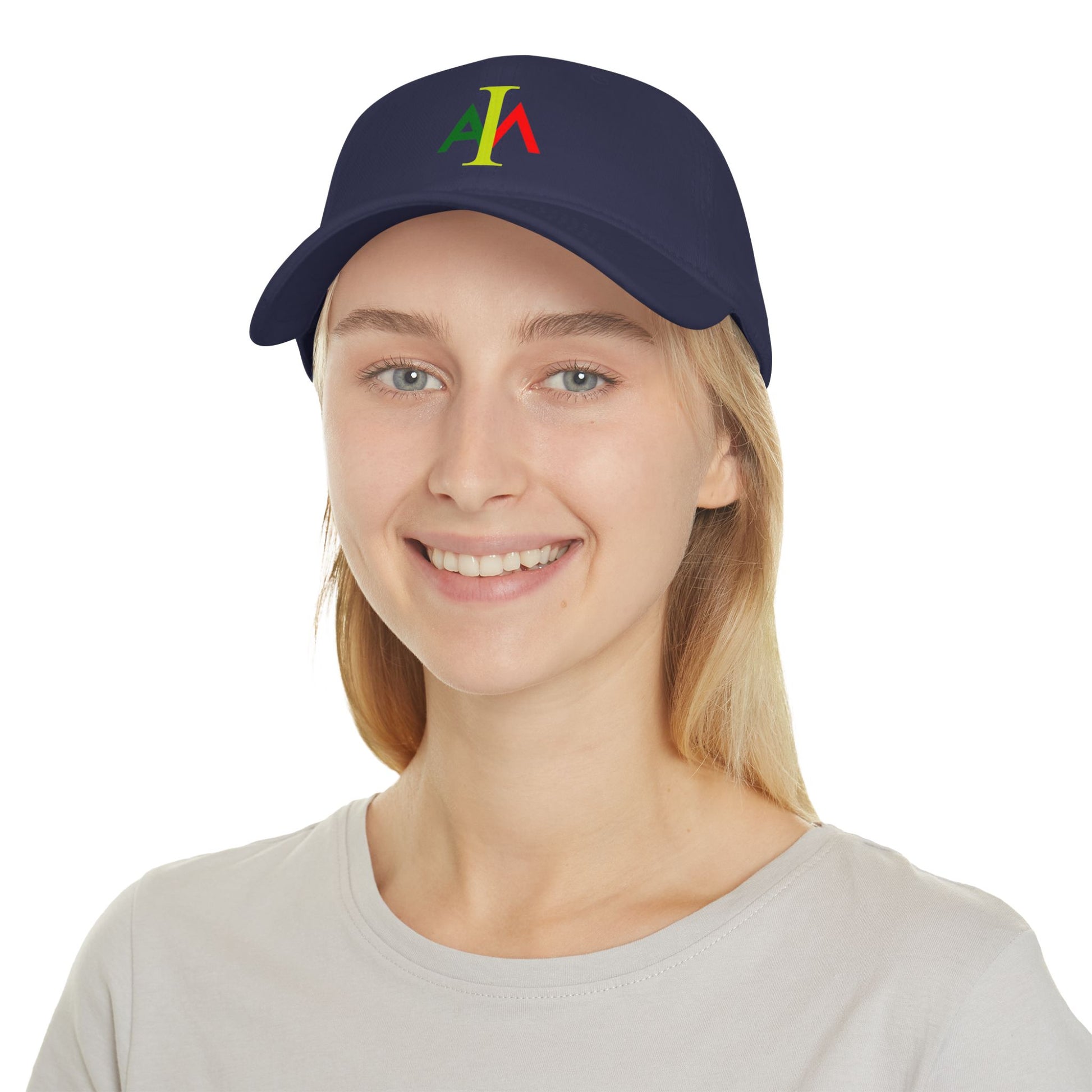 Person wearing a navy blue cap with colorful logo on a white background