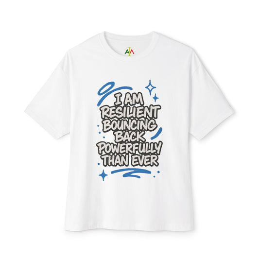 White oversized boxy tee with a graphic that says 'I AM RESILIENT BOUNCING BACK POWERFULLY THAN EVER' in black lettering.