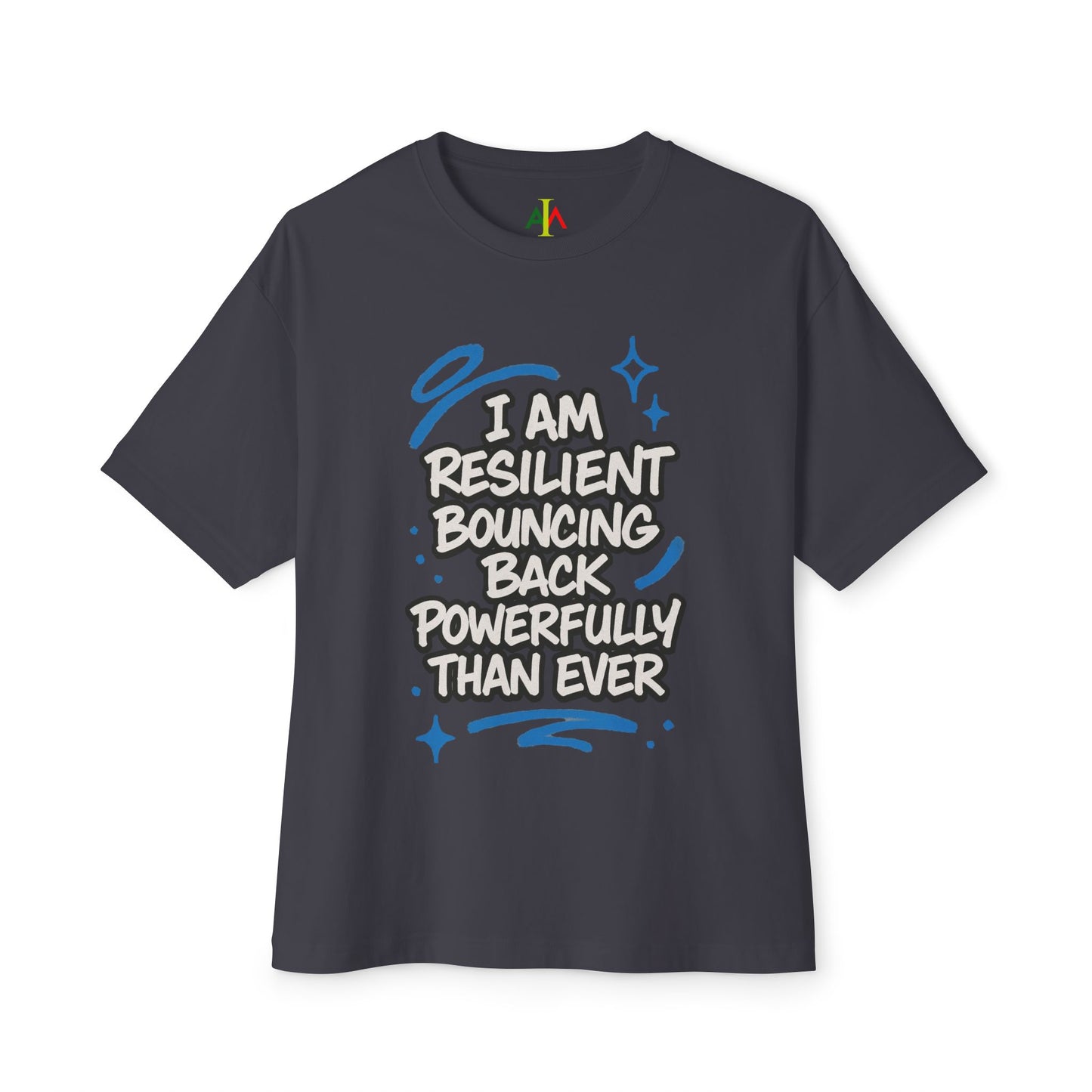 White oversized boxy tee with a graphic that says 'I AM RESILIENT BOUNCING BACK POWERFULLY THAN EVER' in black lettering.